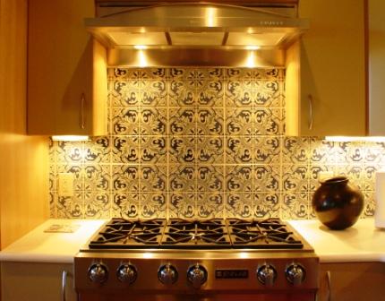 cooktop and tile backsplash